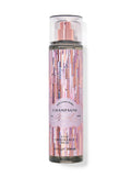 eliteessence Bath & Body Works Champagne Toast fragrance mist in a festive pink and gold glitter bottle