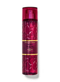 eliteessence Bath & Body Works Petal Parade fine fragrance mist in a textured deep magenta bottle with gold accents.